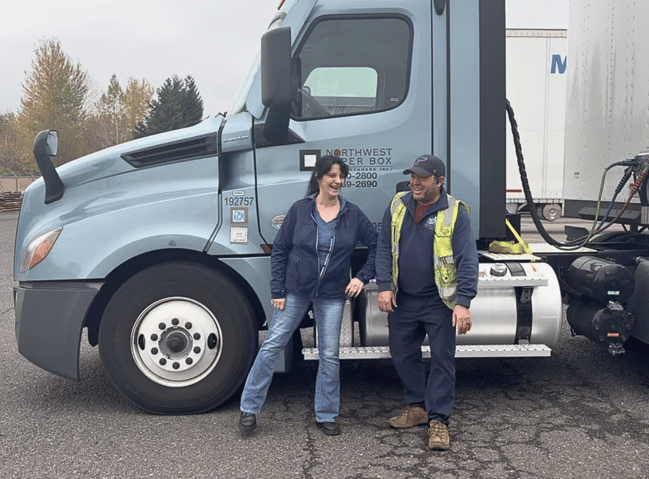 Two NWPB employees in front of NWPB truck