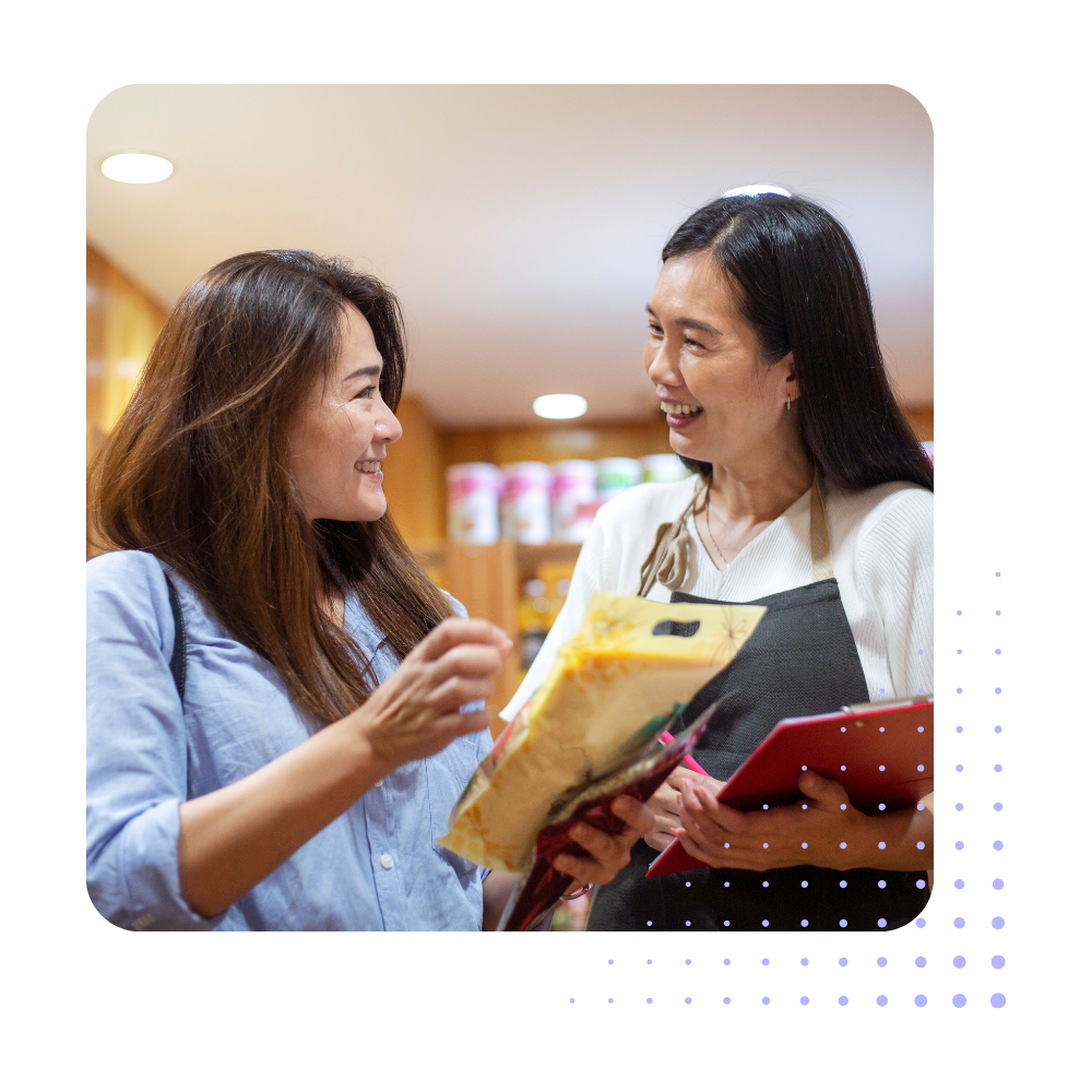 Two Women Looking at Products Two Women Looking at Products